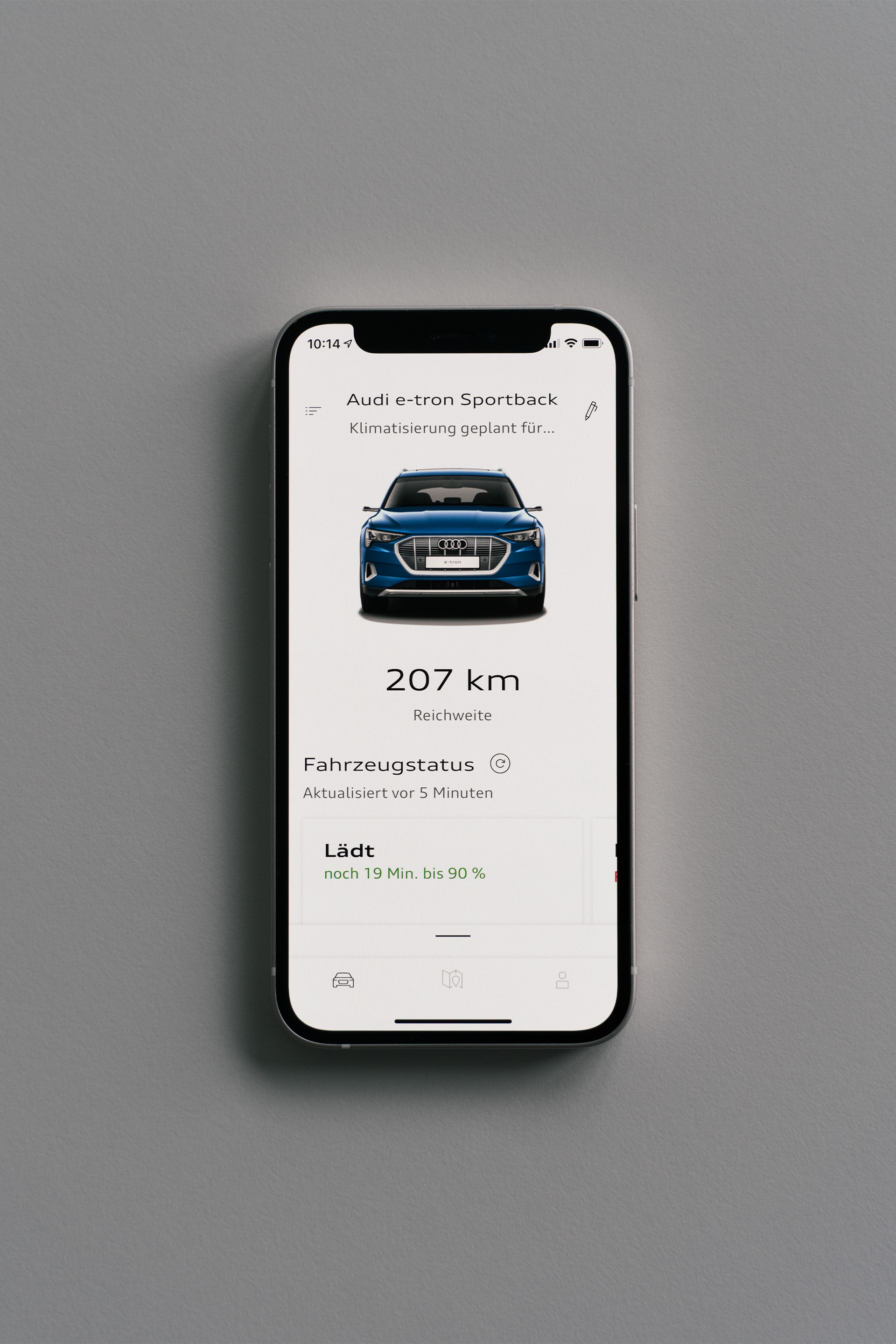 A screenshot of the myAudi app shows the vehicle status for a blue car with 207 kilometers on the clock.